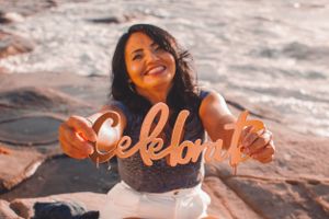 Seaside portrait series with natural smiles and golden sunset lighting.