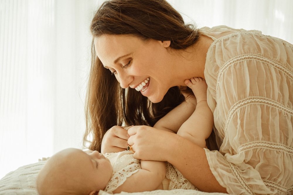 Tender moment between a mother and her baby during a studio photoshoot