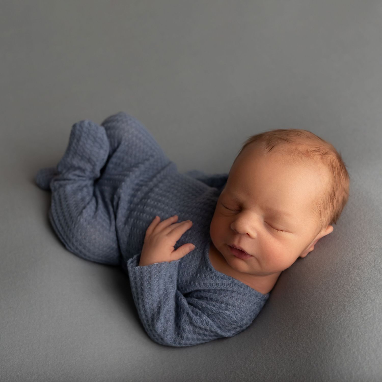 Newborn in blue, taken by Jen Knightstep, Photographer