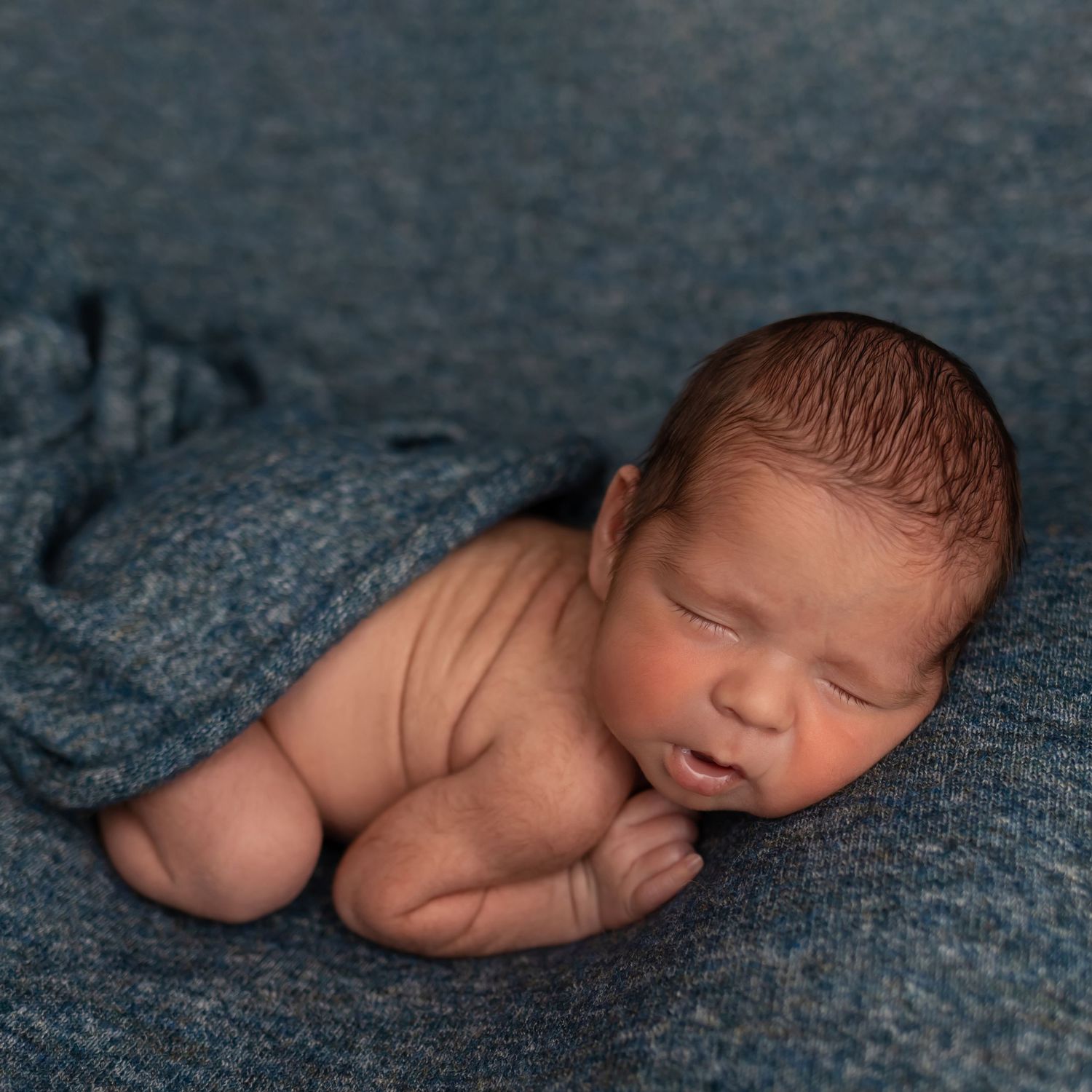 Newborn in blue, taken by Jen Knightstep, Photographer
