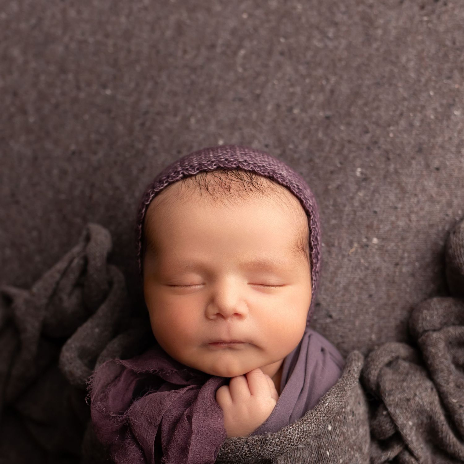 Newborn in purple, taken by Jen Knightstep, Photographer