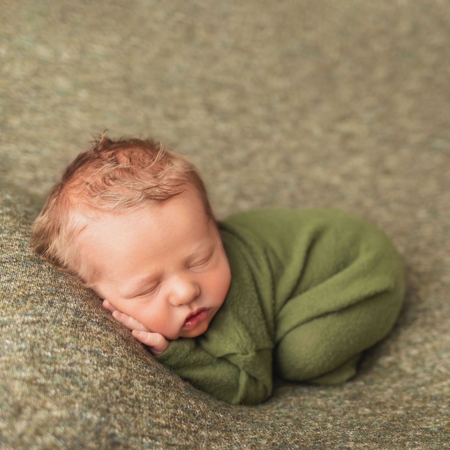Newborn in green, taken by Jen Knightstep, Photographer