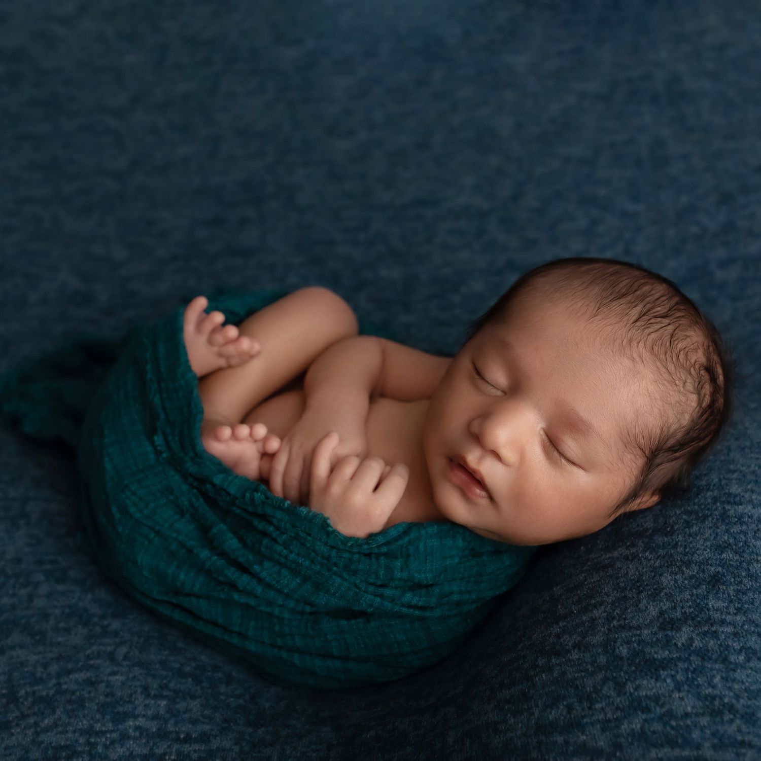 Newborn in blue, taken by Jen Knightstep, Photographer
