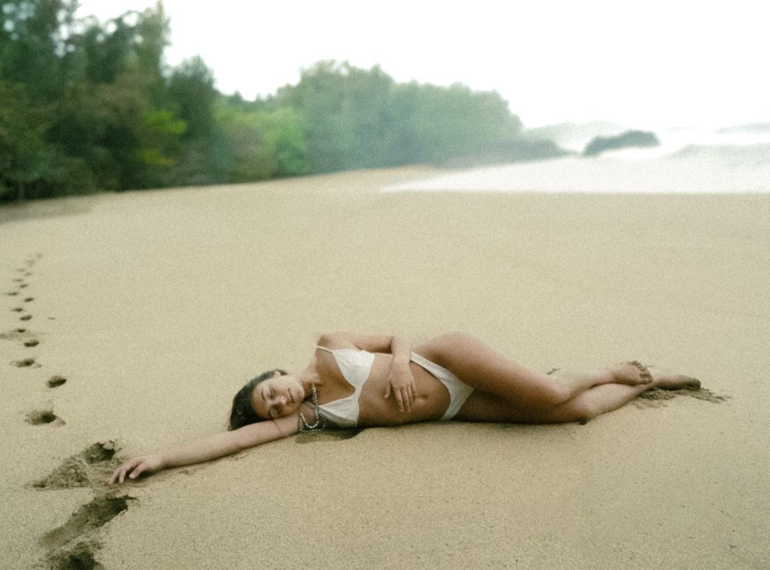 morning sun in Hawaii is the best time to lay in the sand at a beach
