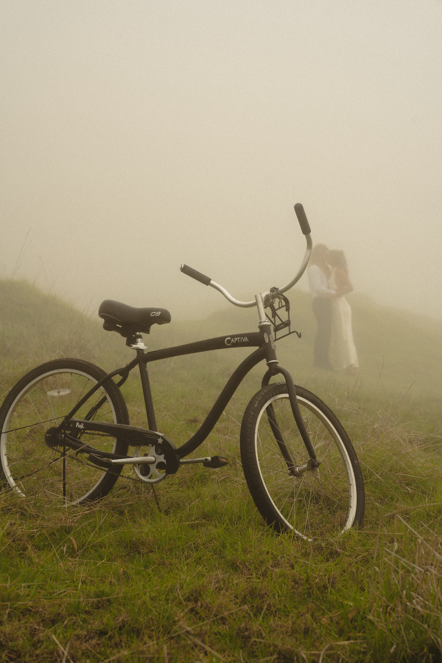 a couple enjoying each others company walking in the fields of grass in Hawaii