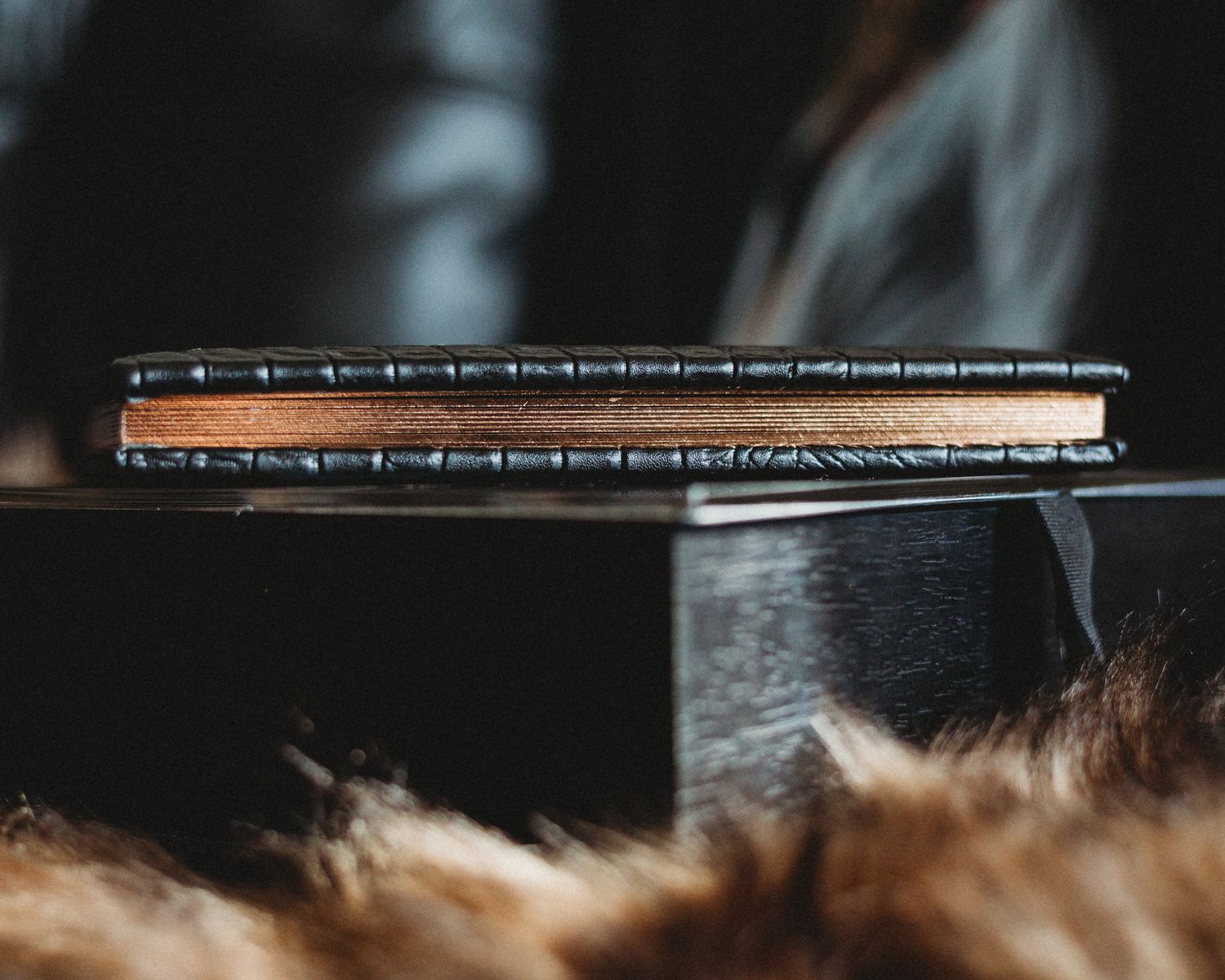 Close-up of smoking incense stick with shallow depth of field.