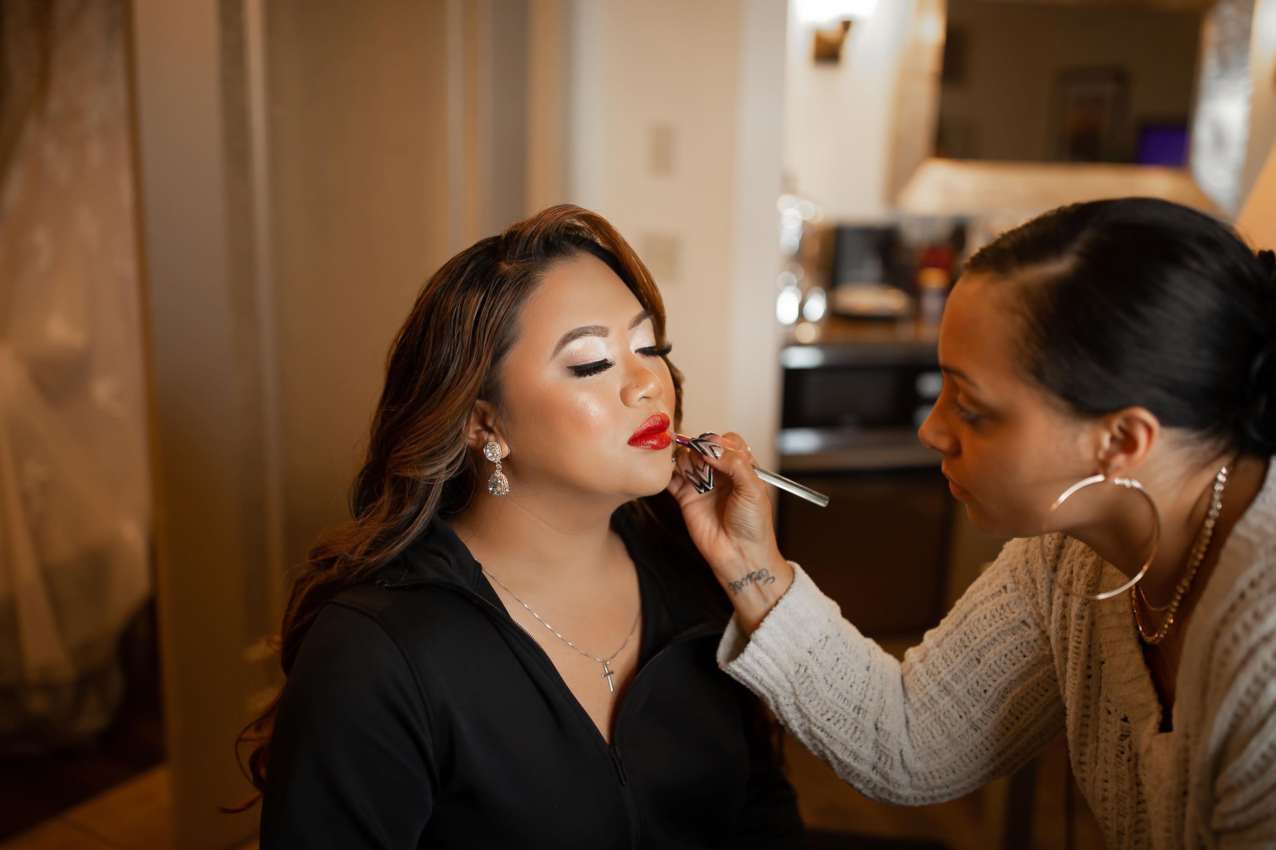 Professional bridal makeup application during wedding preparations by Orlando luxury wedding makeup artist Kay Alvarez.
