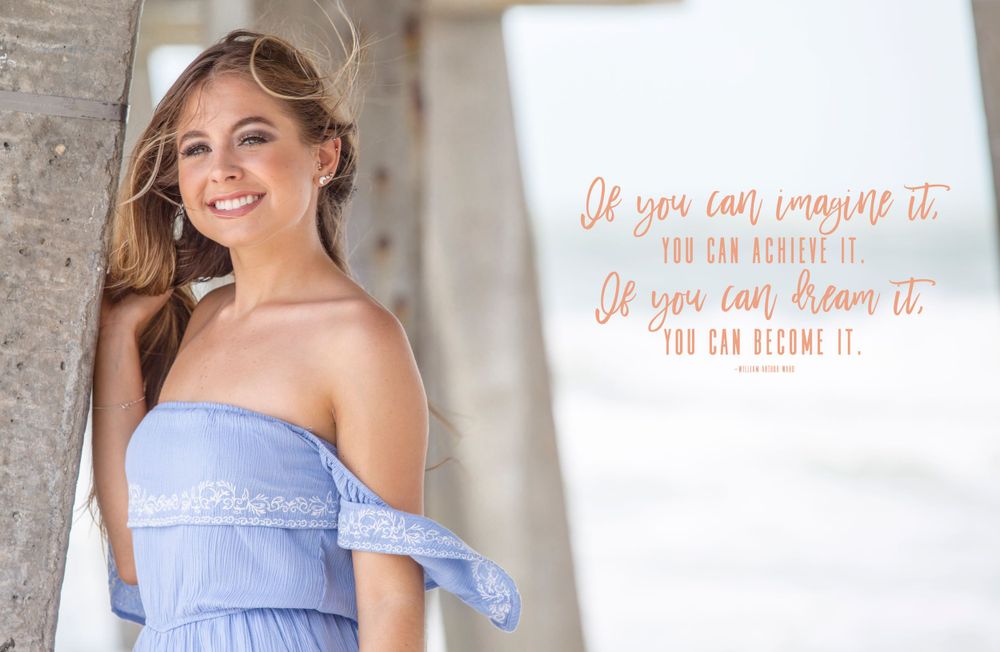 A smiling senior graduate in a blue dress poses with an inspirational quote overlay.