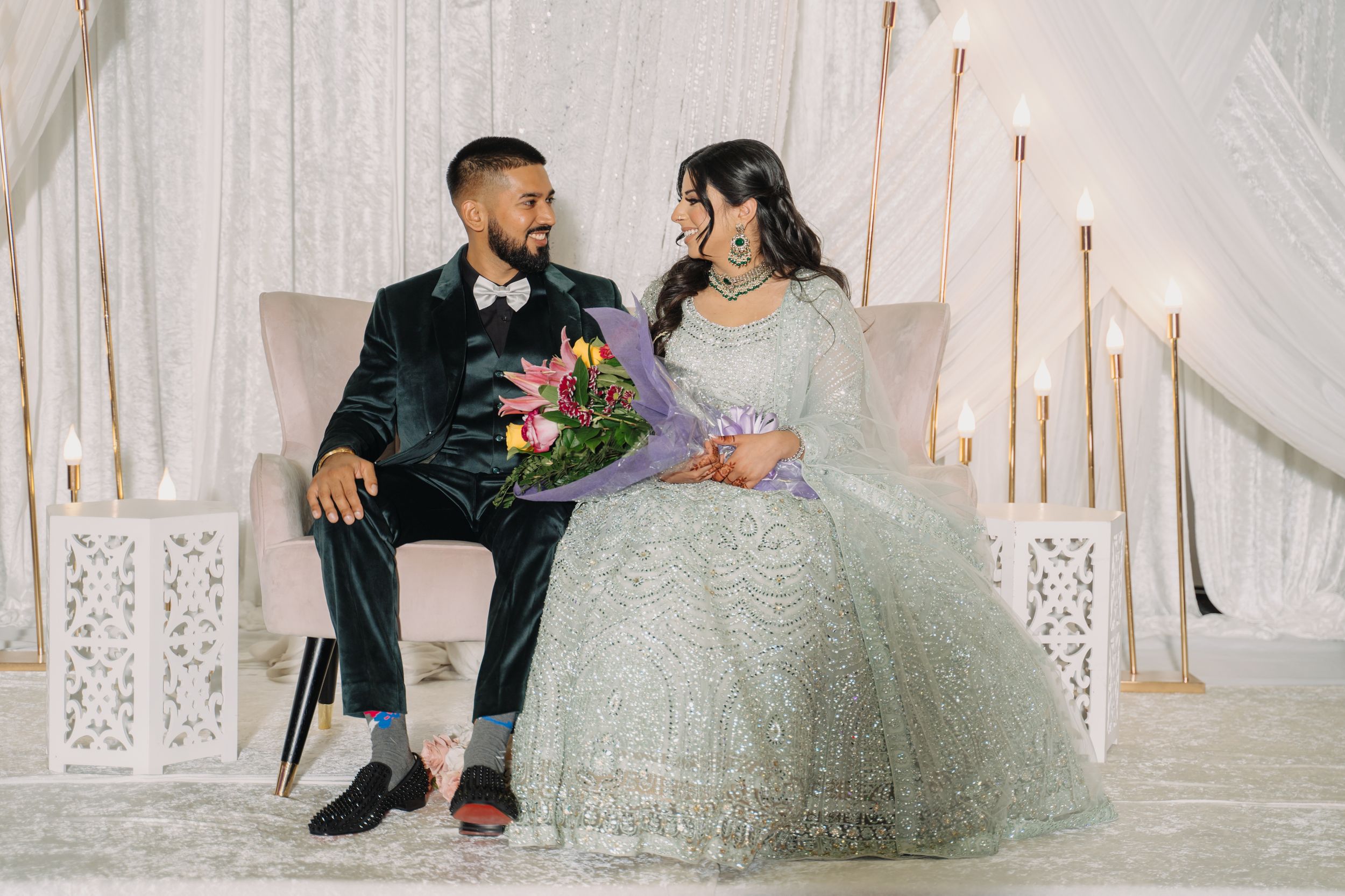 A joyful couple sharing a heartfelt moment, celebrating their love and future together.