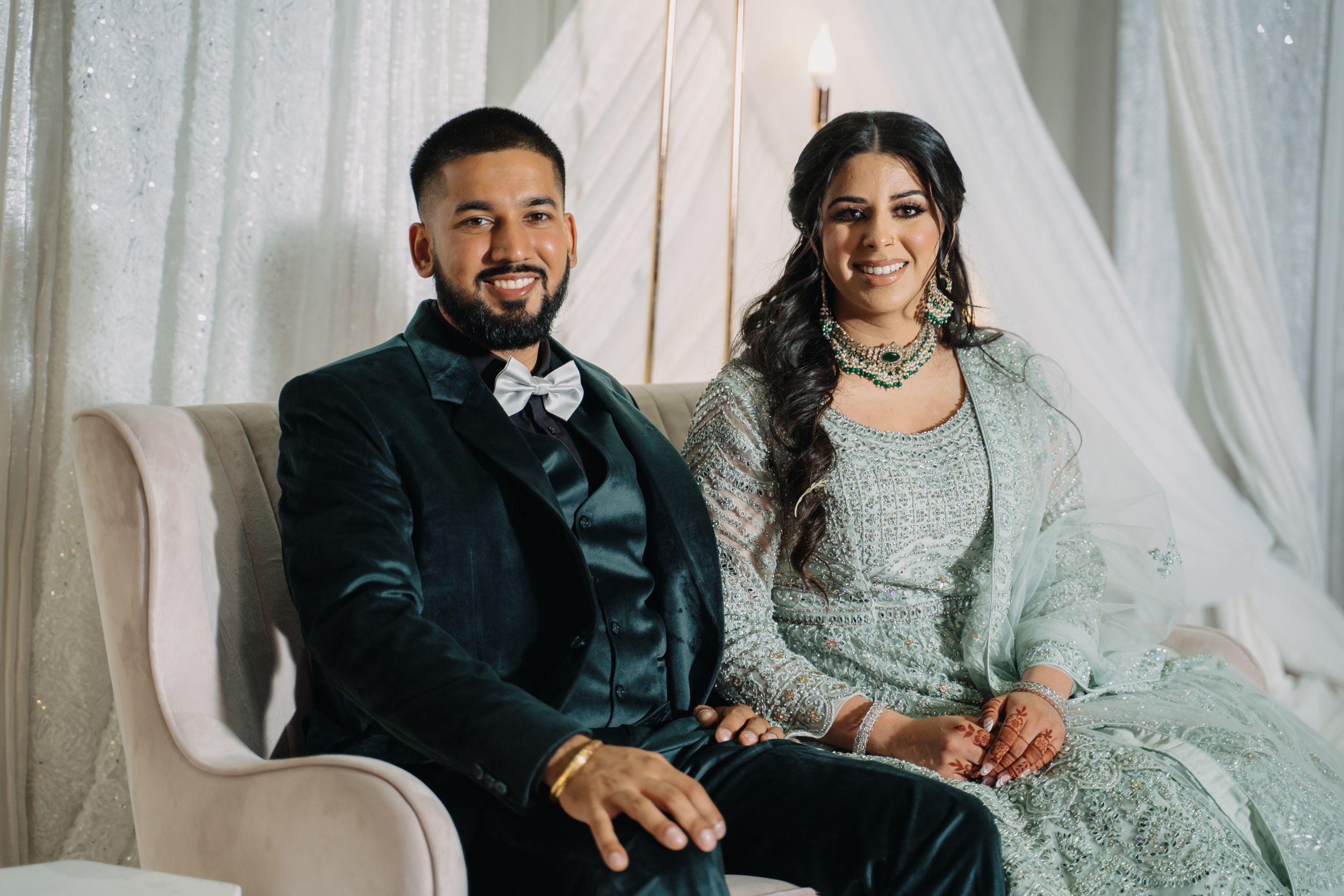 A joyful couple sharing a heartfelt moment, celebrating their love and future together.