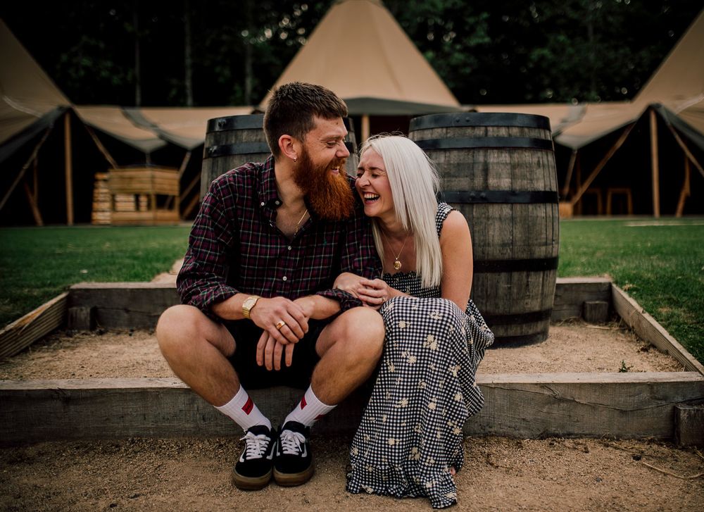 Rustic engagement session with vintage decor and wooden barrels at outdoor venue. Worcestershire Wedding photographer.