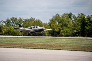 Piper airplane taking off at beaver county airport.