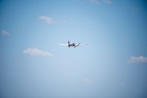 Piper taking off at beaver county airport, blue skies.