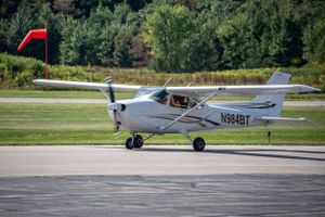 Cessna and windsock taxiing at beaver county airport.