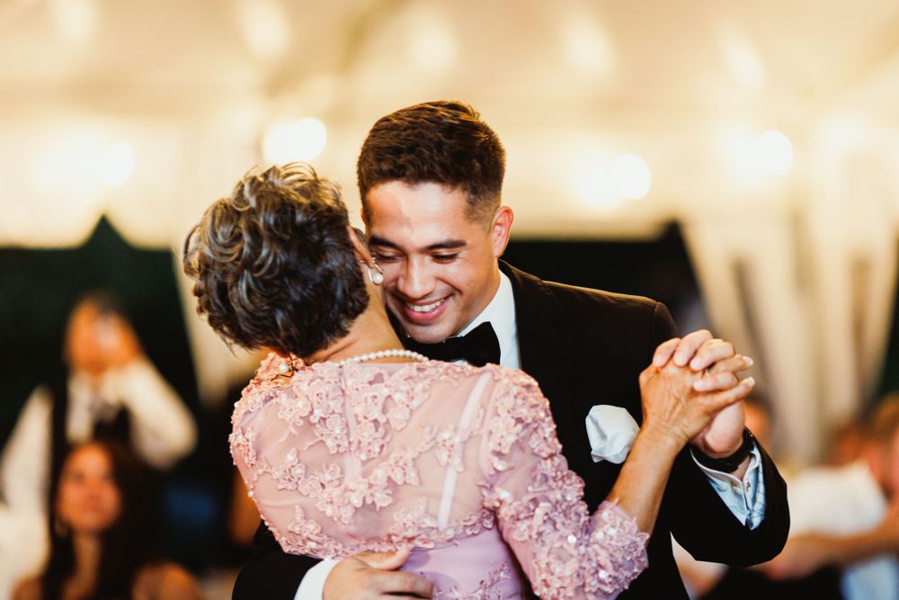 Close-up of tender dance moment at elegant wedding reception.