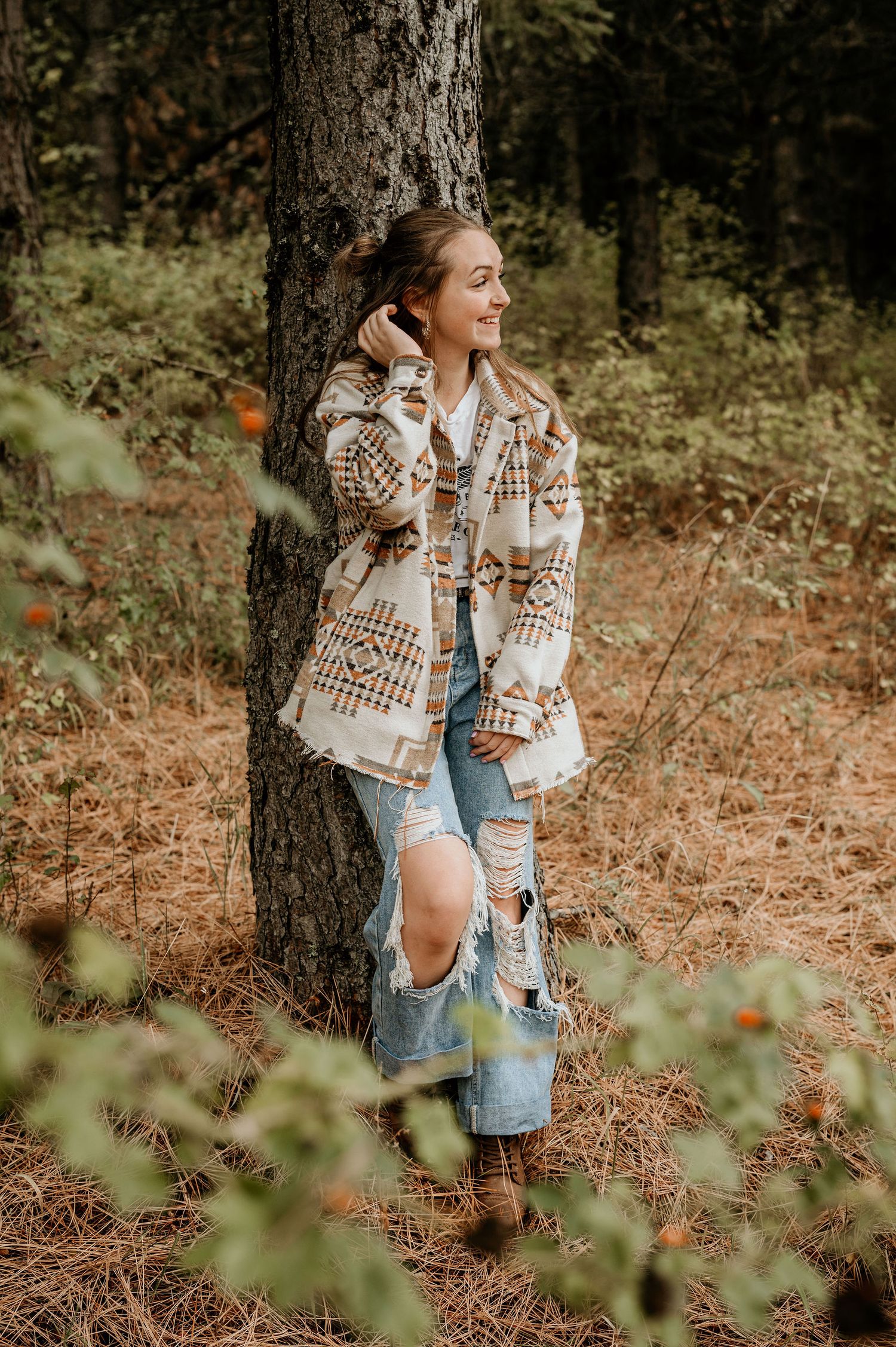 Girl leaning on a tree in the Walla Walla Blue Mountains