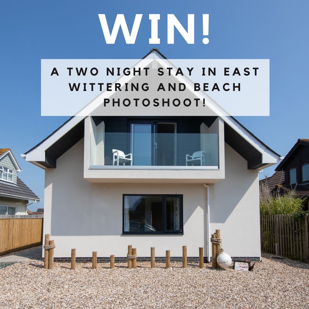 Modern beach house with balcony advertising a two-night stay contest in East Wittering.