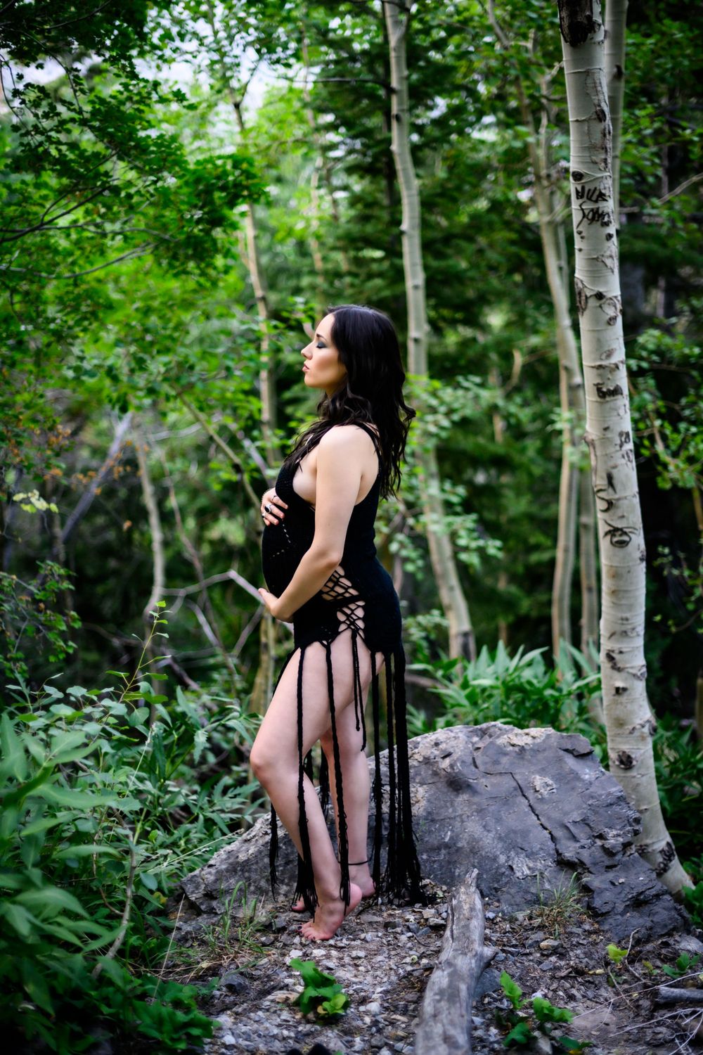 Moody photo of expecting mother in forest of Mt Charleston. Maternity photoshoot in Las Vegas. Maternity photographer Las Vegas.