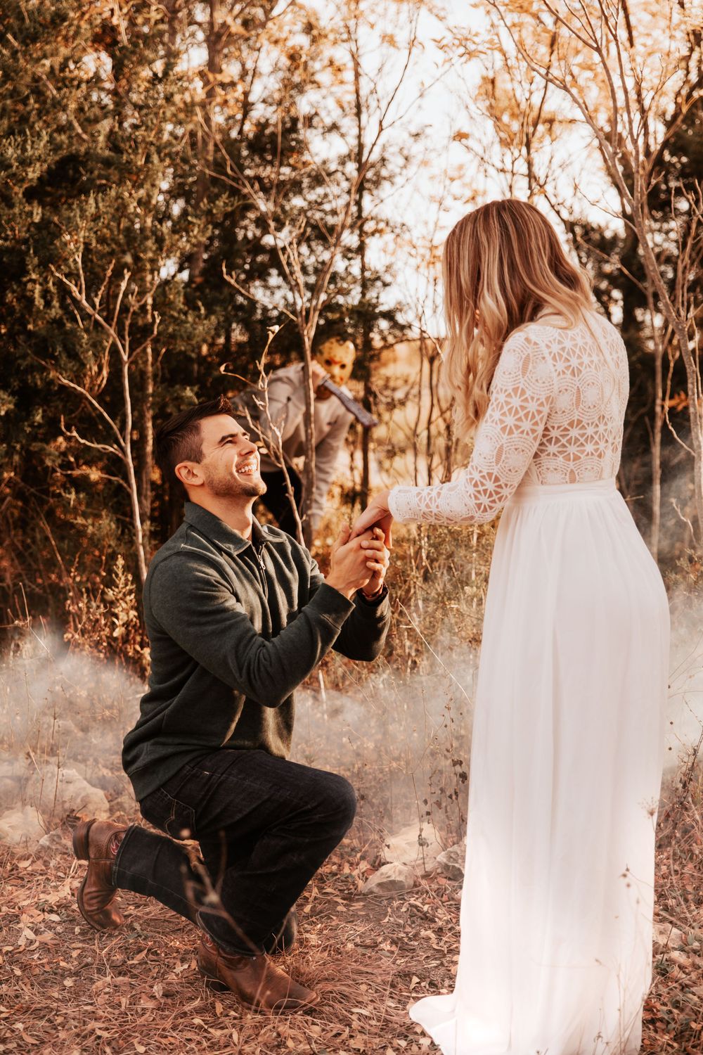 A romantic outdoor marriage proposal moment at sunset with a person kneeling.