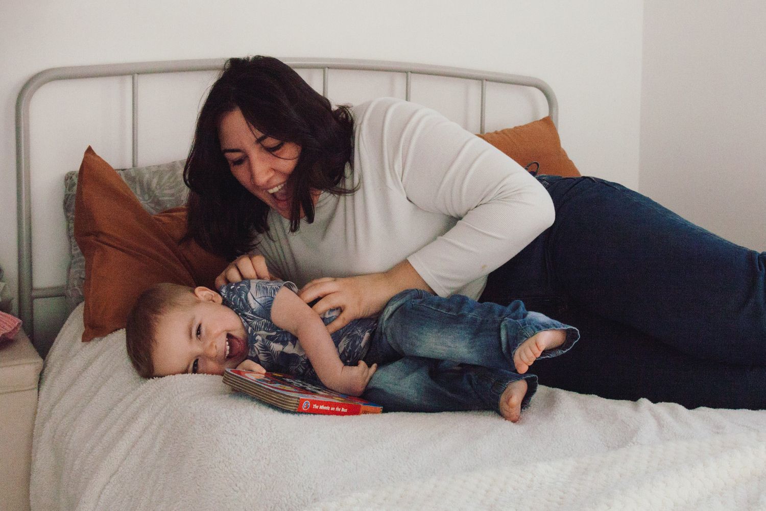 Mother and son tickles game during a photoshoot, photographed by Maria Photography, a family photographer in Gosport.