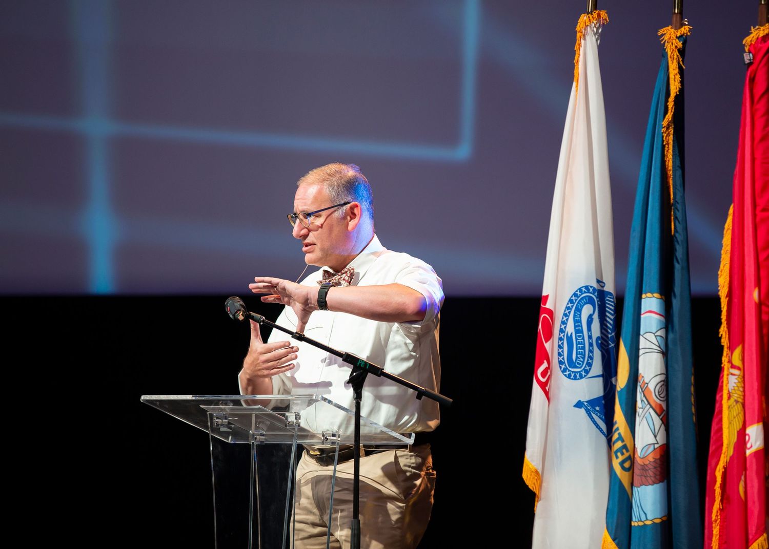Professional conference photography capturing audience engagement during keynote presentation