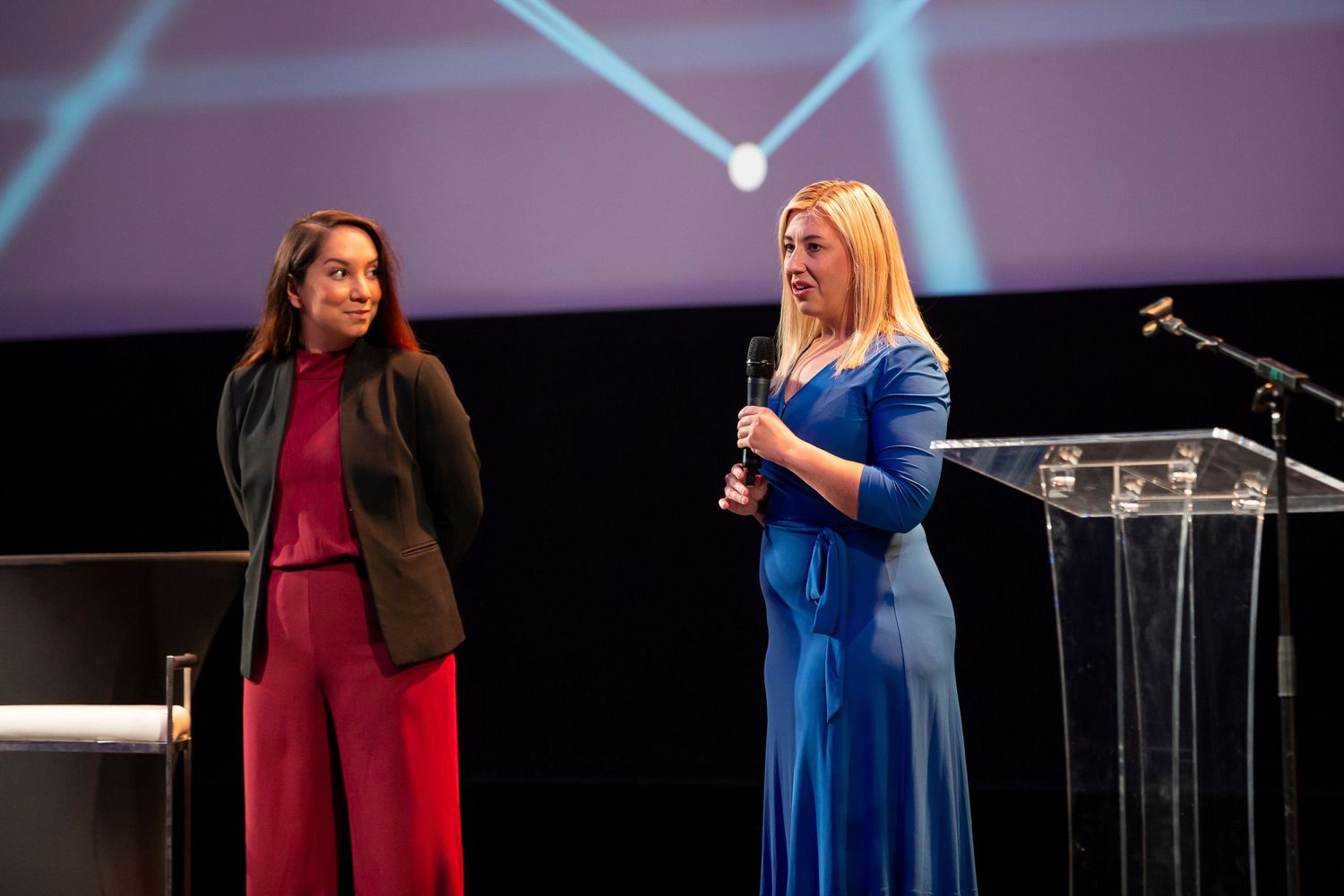 Professional conference photography capturing keynote presentation and audience at Utah corporate event