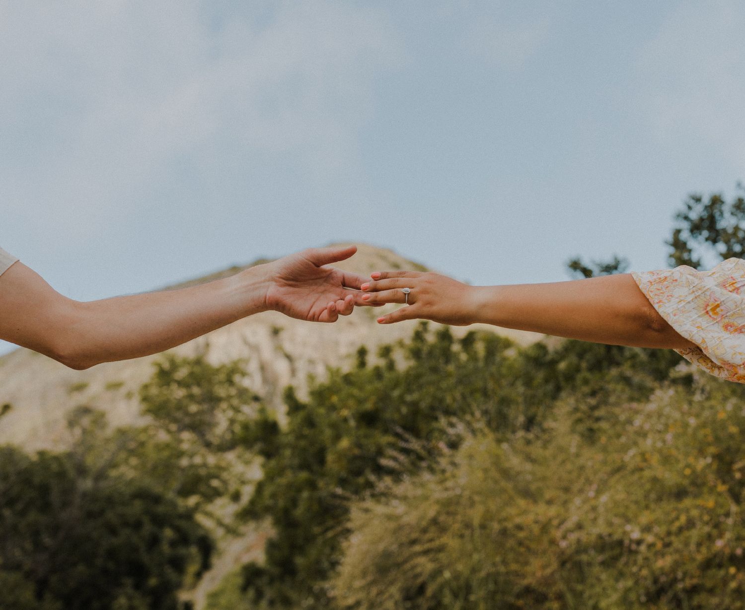E. Noelle Photography couple engagement in the Los Angeles Malibu hills hands touching with landscape in background