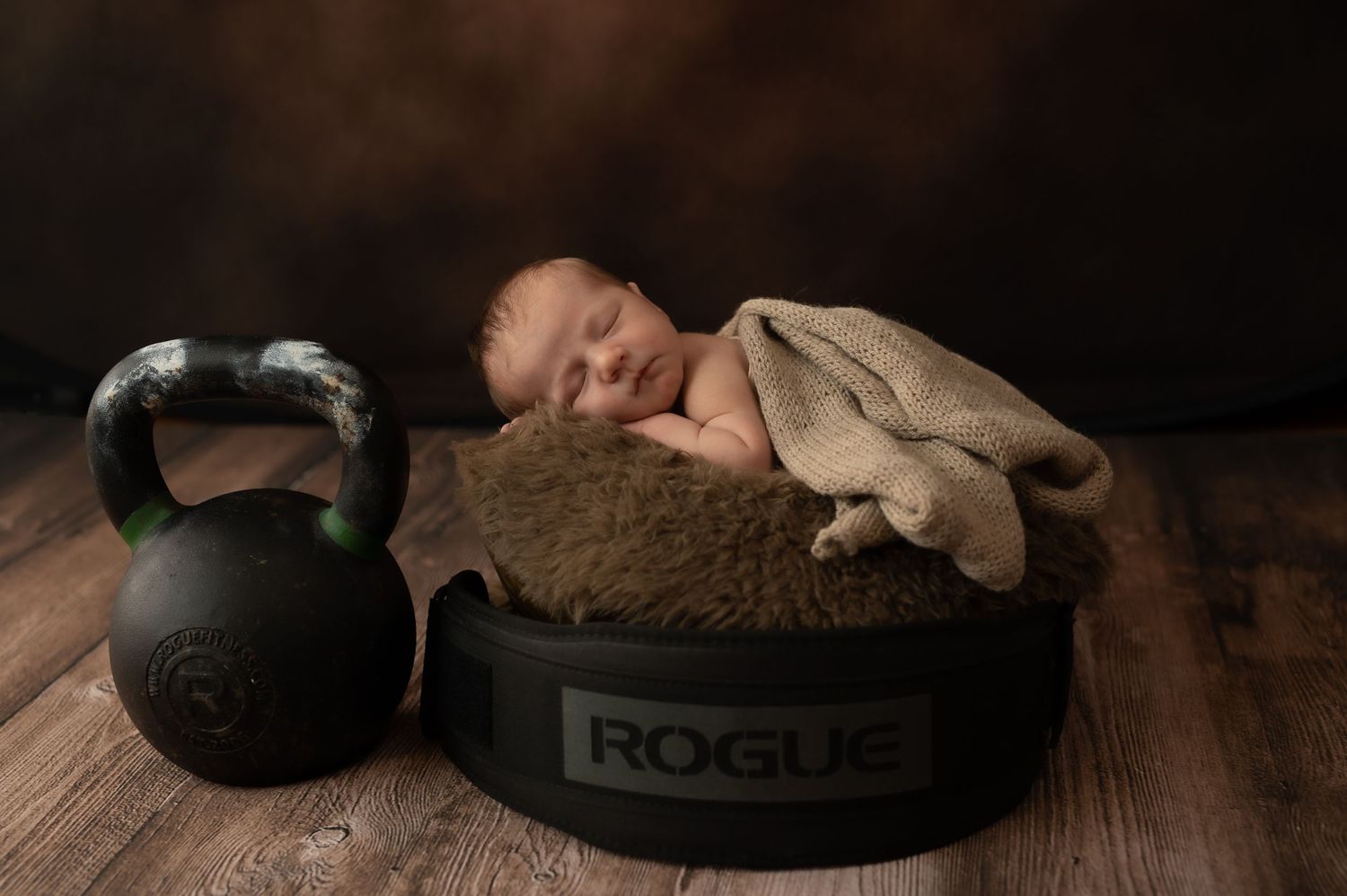 Dark and moody product photography of spa stones and massage tools.
