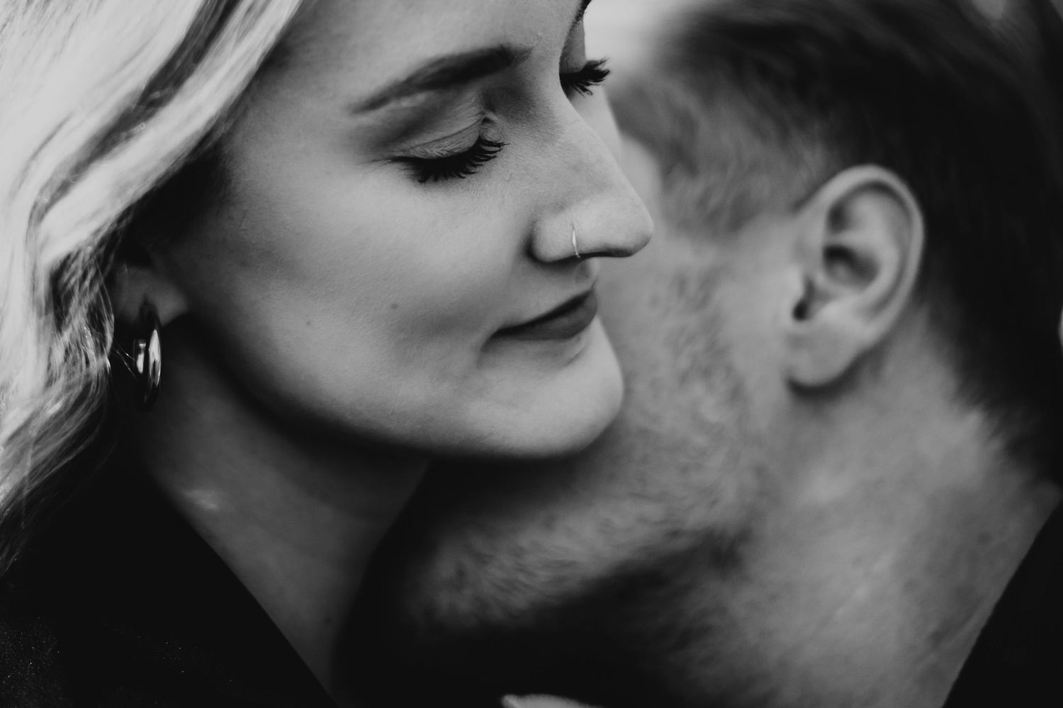 A man kissing a woman's neck