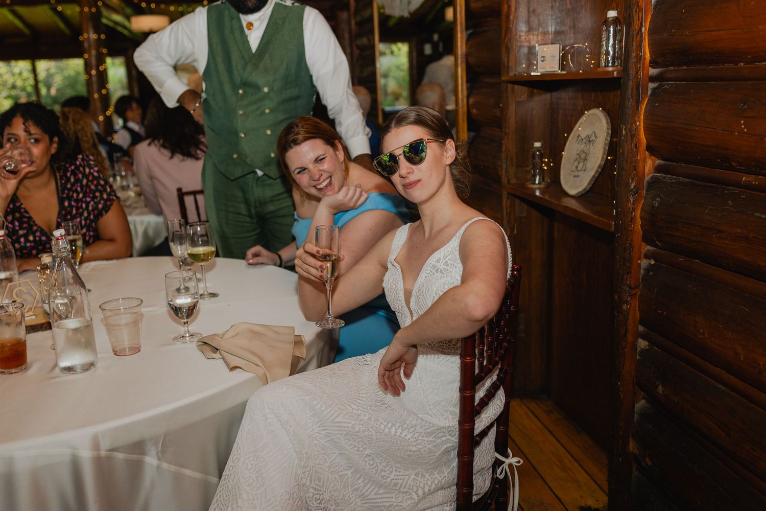 wedding guests laughing and enjoying their time at a wedding at the black canyon inn in Estes park