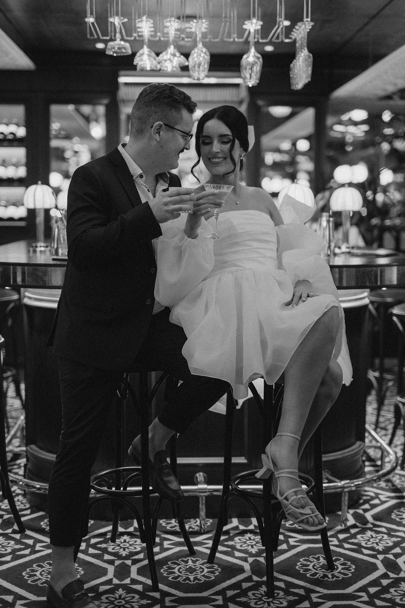 Couple enjoying a drink in a bar during their elopement in Paris