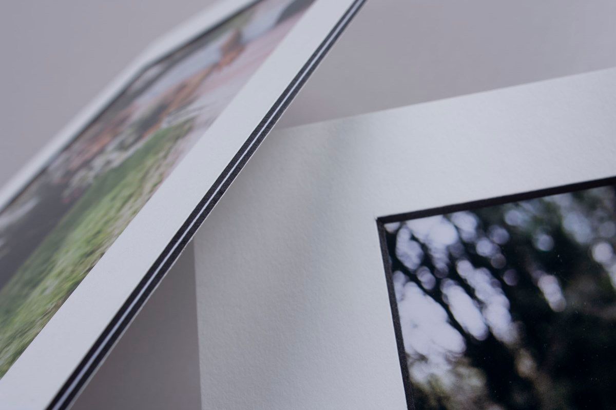 Close-up detail of photo album pages with blurred bokeh effect.