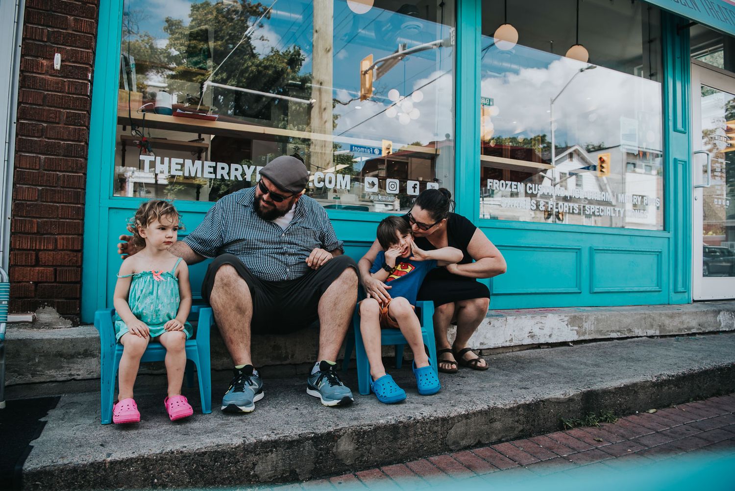 Nothing like the Merry Dairy, in Ottawa ON. A family sits out front on the stoop.
