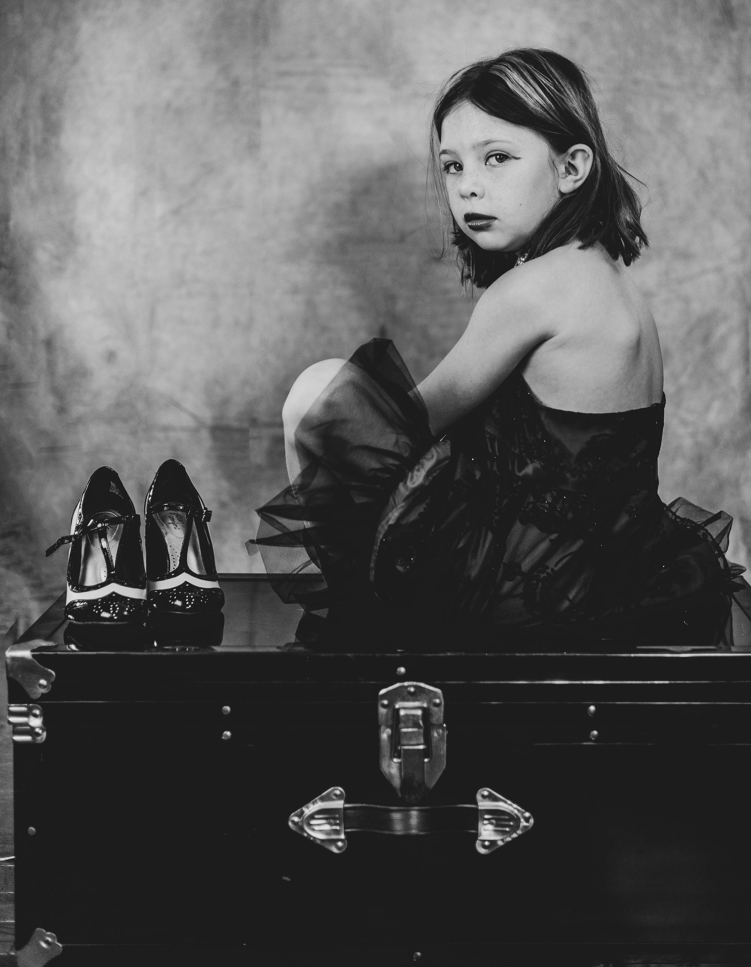 Black and white photo series showing poses on a piano bench.