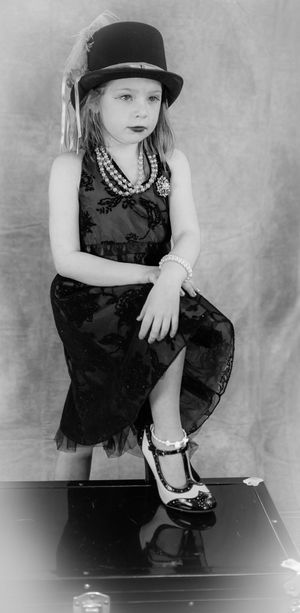 Black and white portraits featuring top hat and classic dance attire.