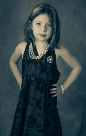 Stylized portraits in dark tones featuring a burgundy dress and pearl accessories.