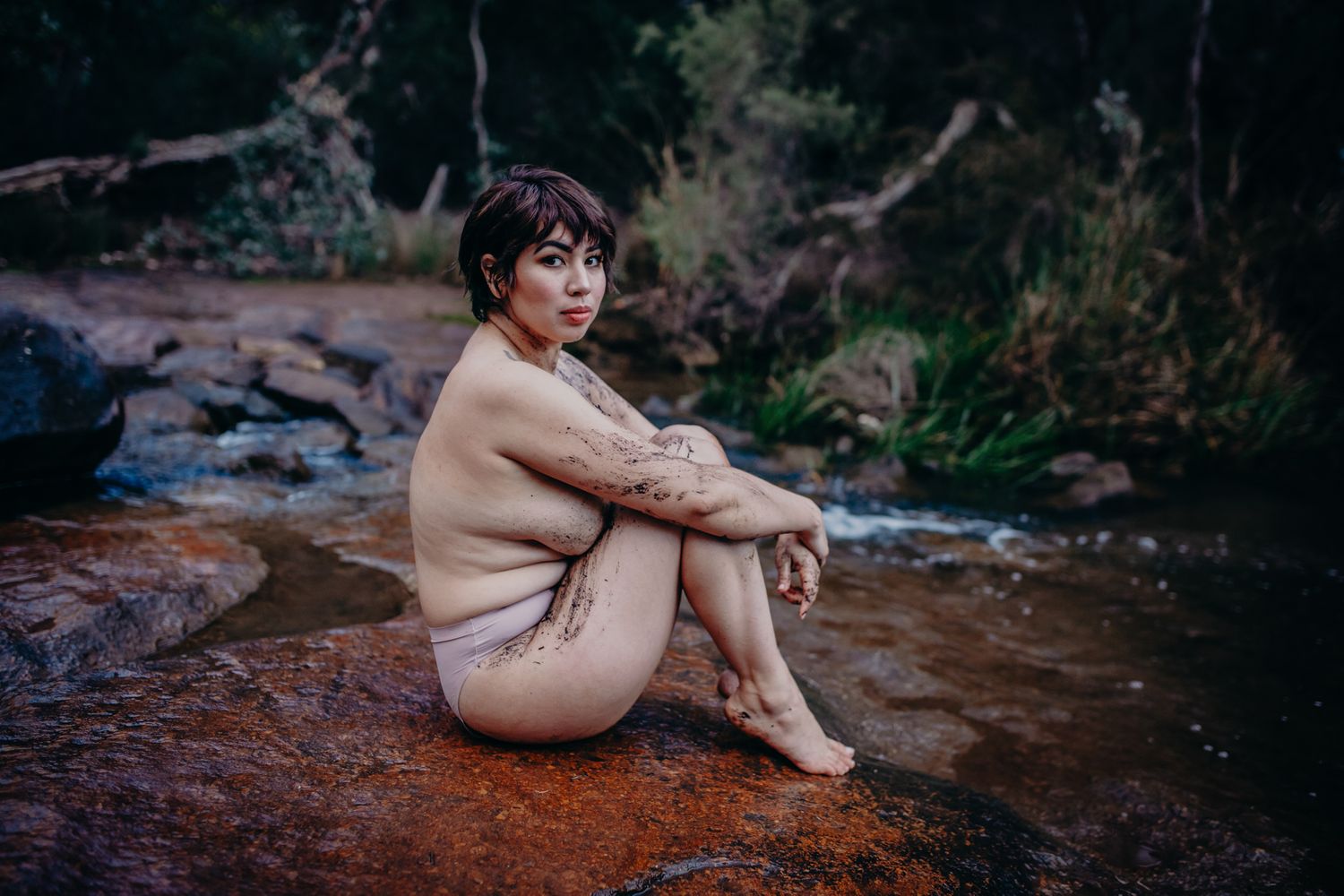 Serene nature portrait showcasing natural curves of rock formations and forest scenery.