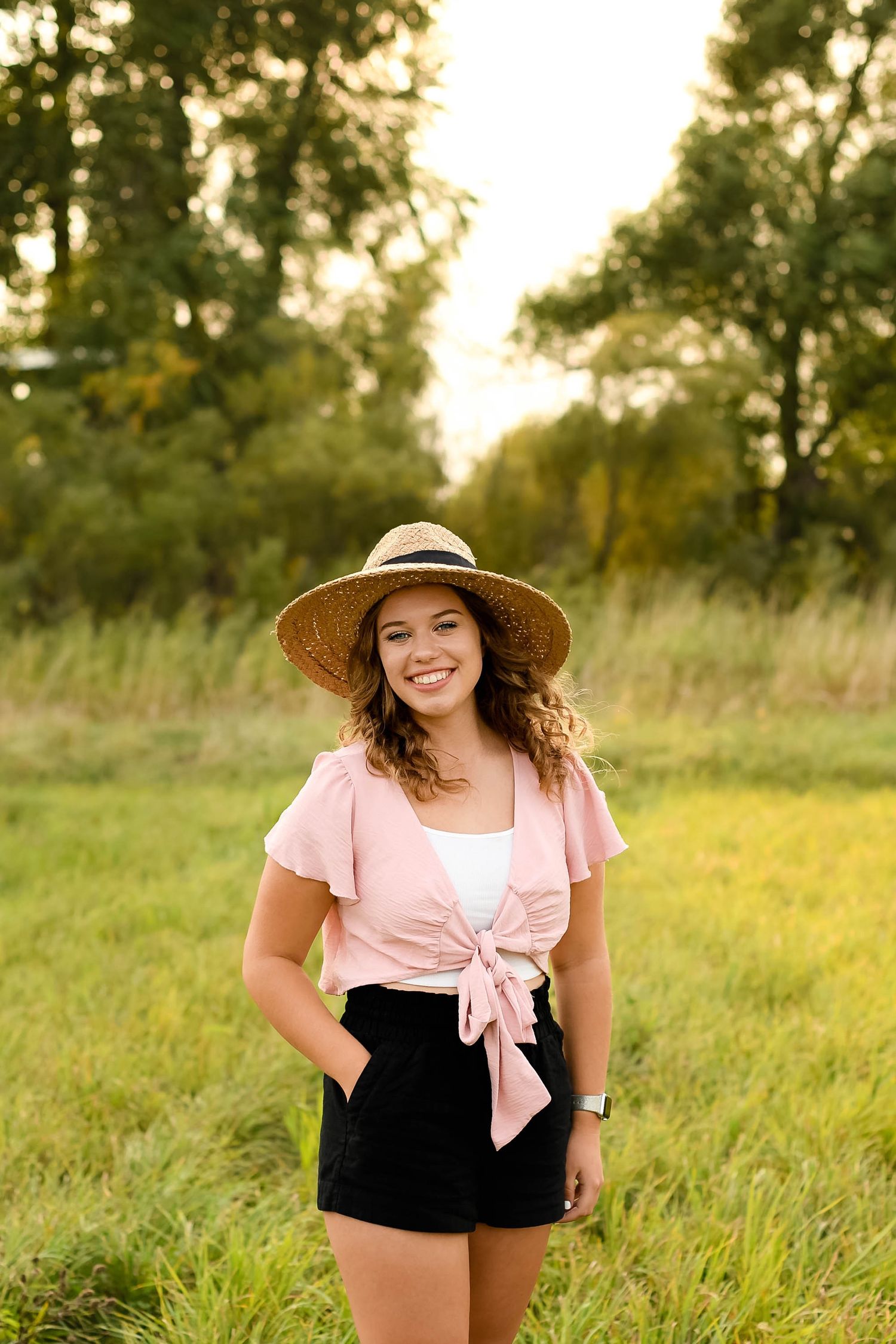 girl in hat wearing pink