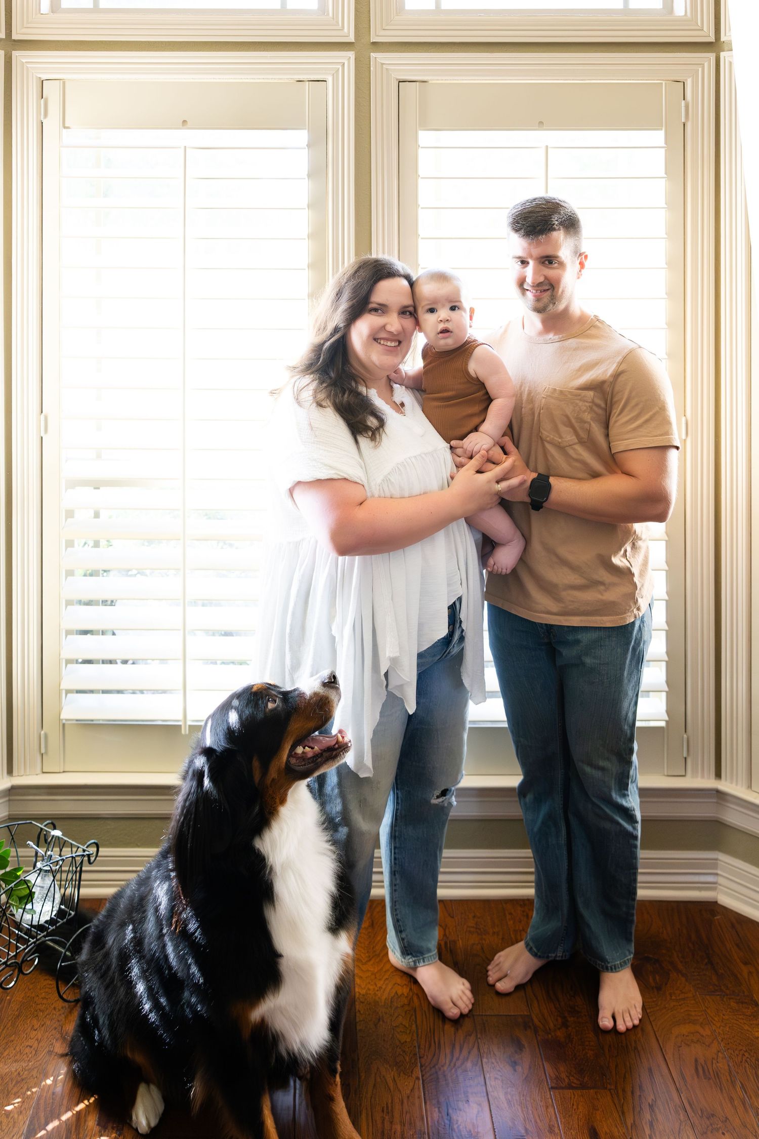 A young family and their dogs are photographed inside their home by Blessie MJ Photo
