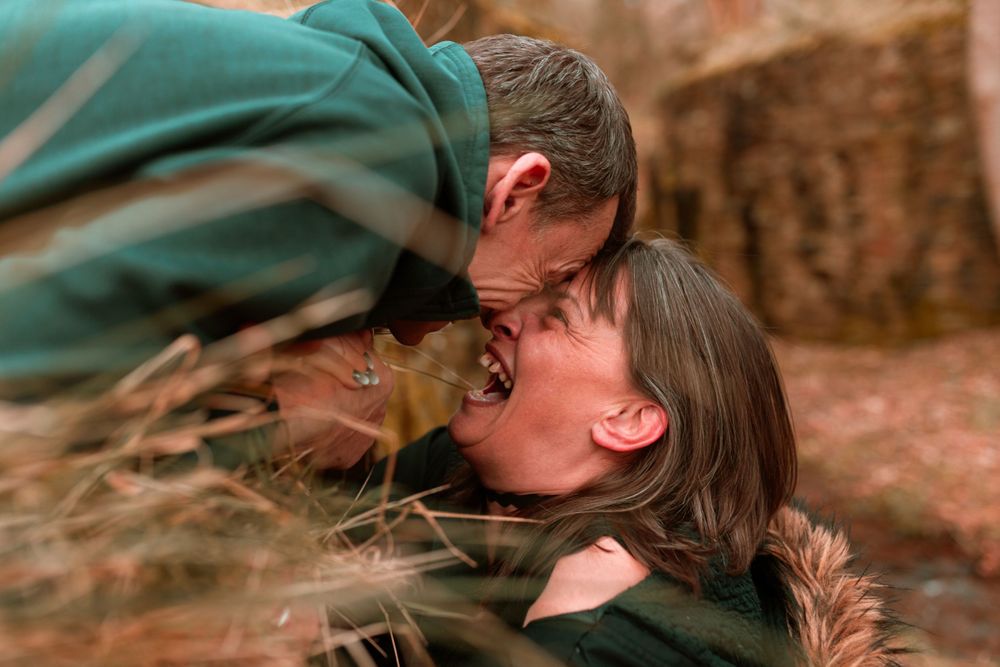 Intimate romantic moment captured between two people outdoors.