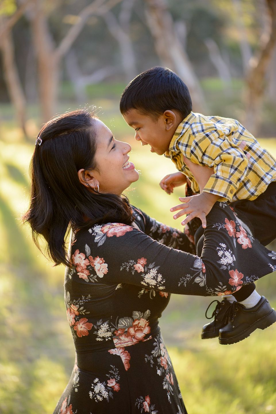 Mother lifting young son in the air - Kelly Chapman Photographer Perth