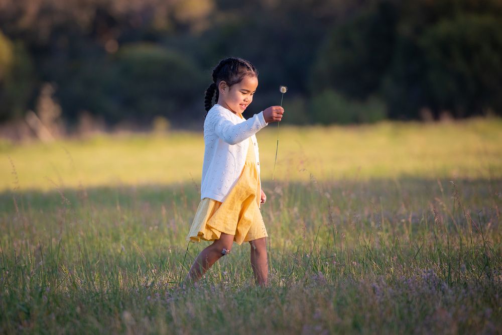 Young girl walking in an open field - Kelly Chapman Photographer Perth
