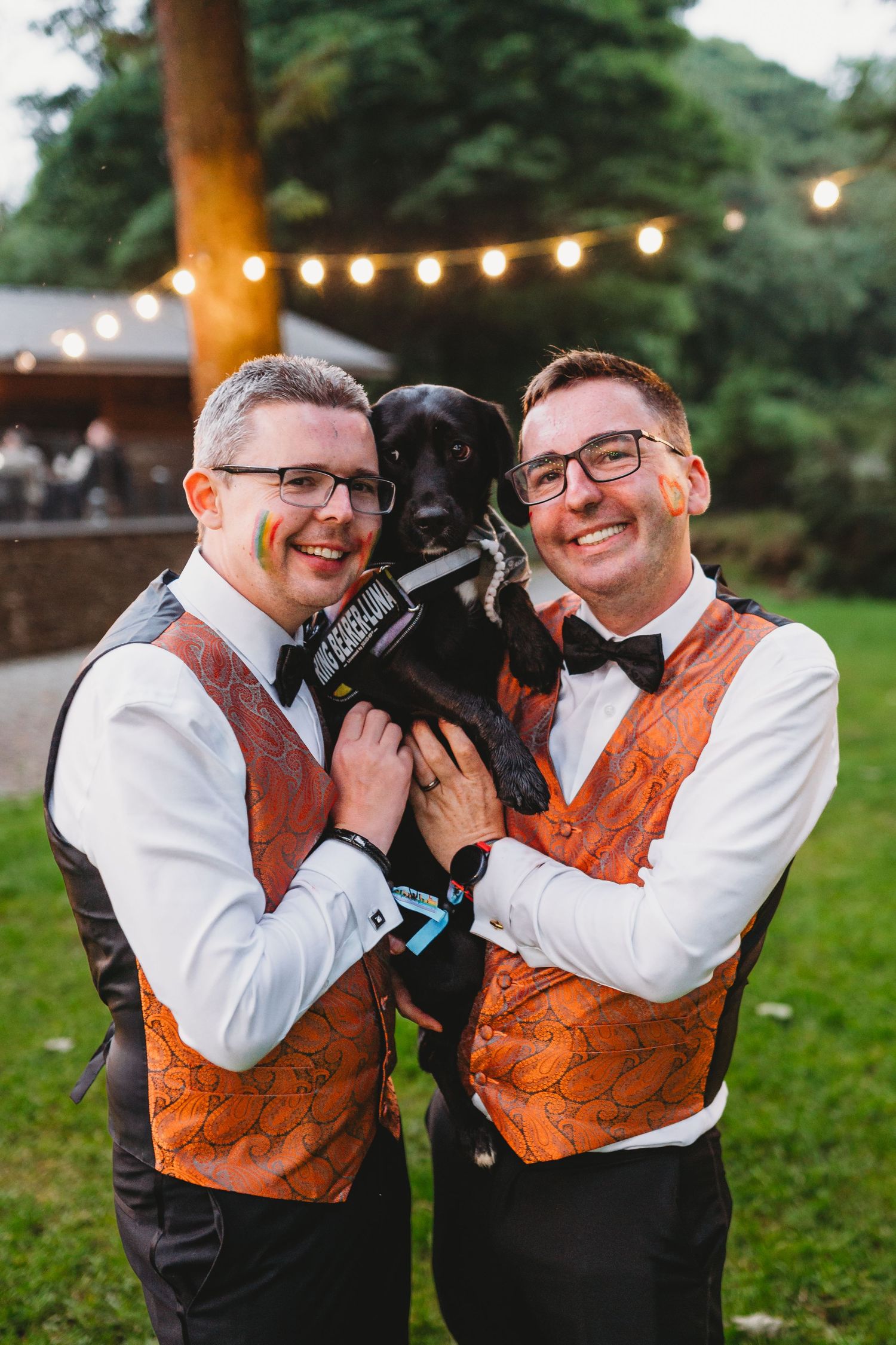 Romantic sunset portraits of newlyweds in front of a historic stone building.