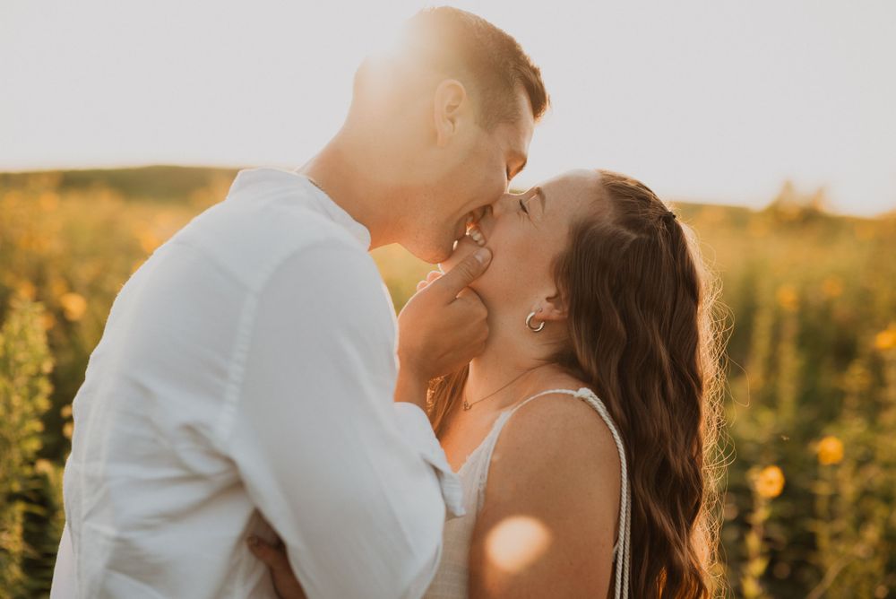 Romantic sunset photoshoot in a field of yellow wildflowers.