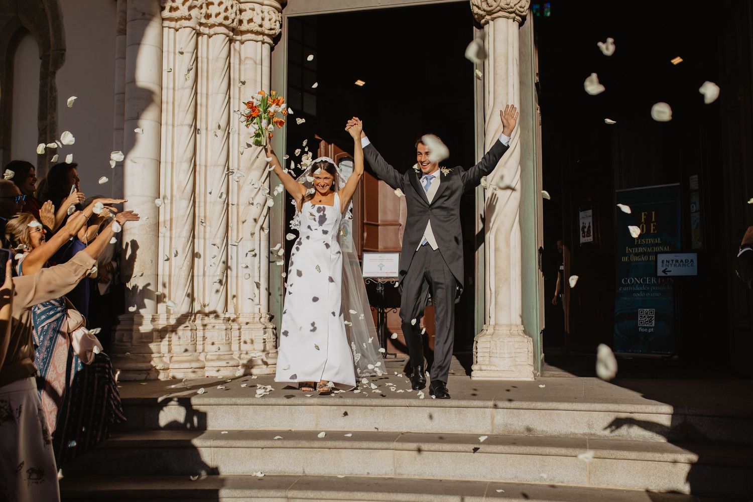 Romantic black and white wedding portraits captured in a lush garden setting.