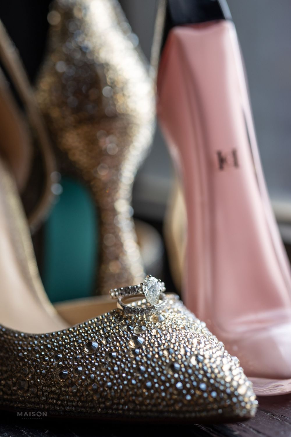 Sequence of close-up shots showing a sparkly silver shoe with rhinestone embellishments against a blurred background.