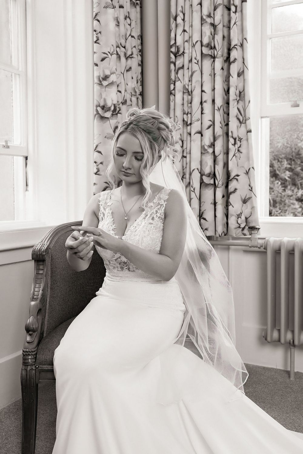 Black and white wedding photography triptych showing a bride in a lace gown sitting by a window with floral curtains.