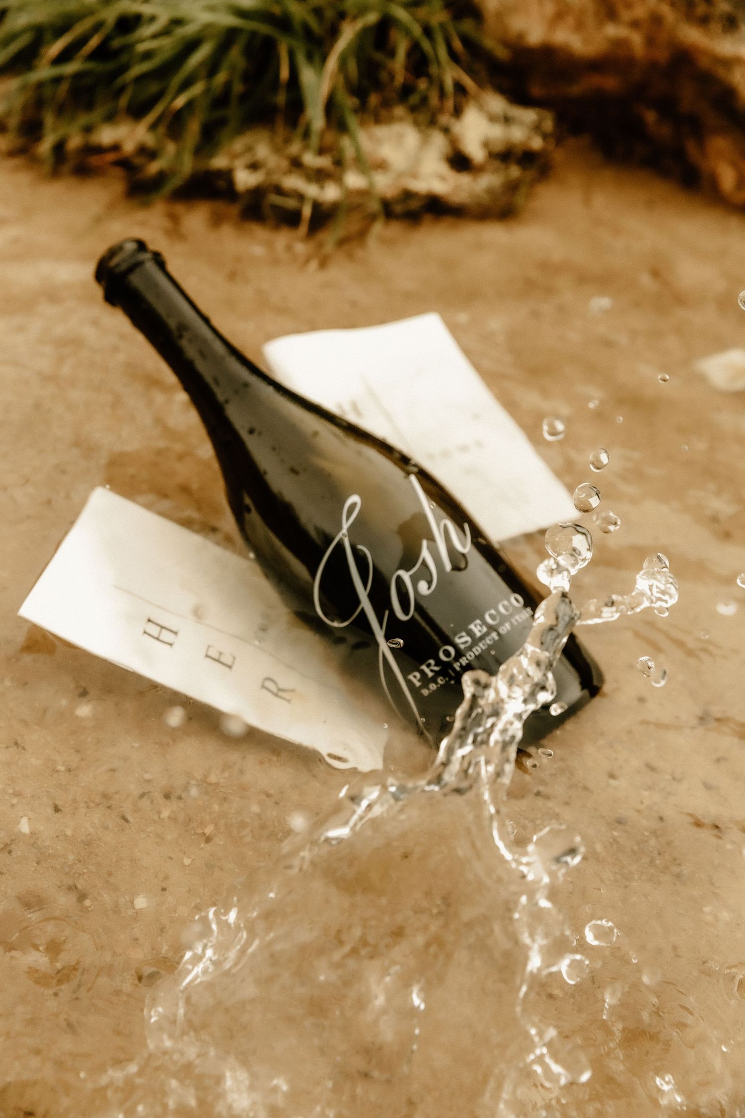 Artistic photo of champagne bottle splashing with vintage sepia tones.