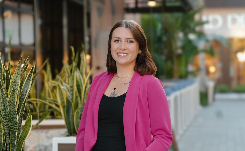 Branding headshot of woman in front of building in Tampa, FL.