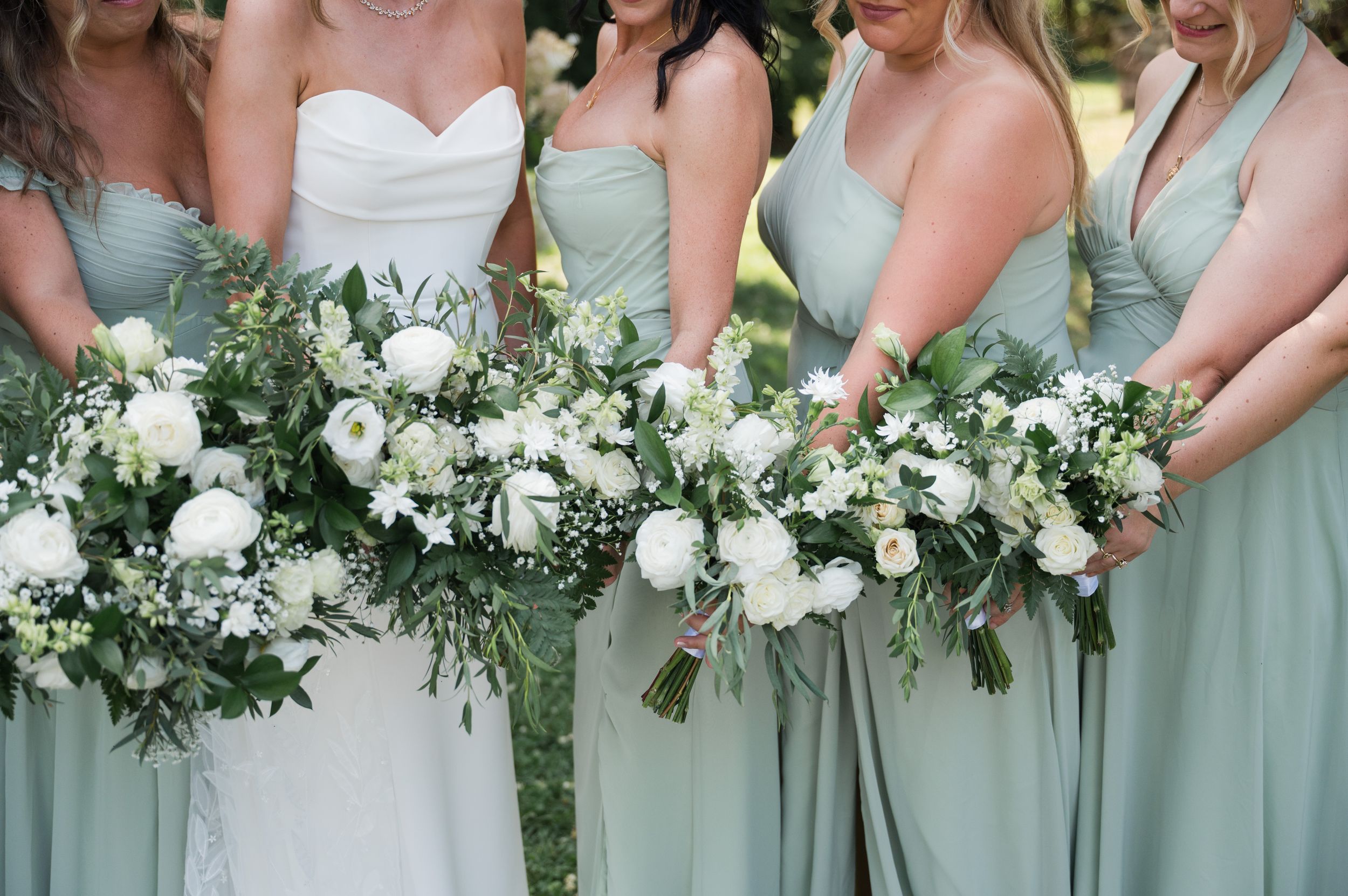 Elegant mint green bridesmaids bouquets featuring white flowers and lush greenery. Kalmia Garden at Gastler Farm